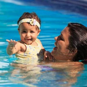 mother and infant in the pool