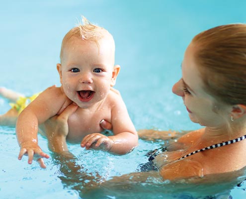 infant learning swimming lessons