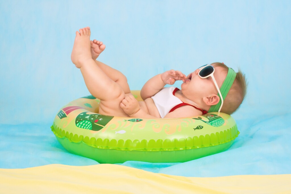 infant in a pool floatie