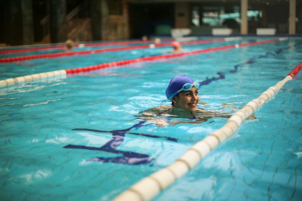 Woman smiling while in a swimming pool