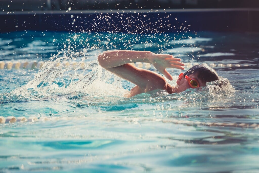 child swimming in the water